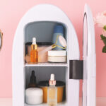 should-you-own-a-skin-care-fridge-fridge-with-skincare-in-front-of-pink-background