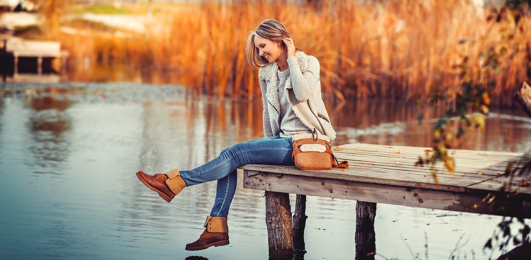 sustainable-fashion-ethical-environmental-impact-woman-sitting-on-dock